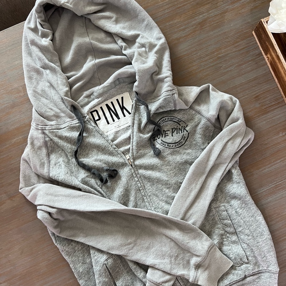 Heather grey zip up PINK hoodie. Size xs. Great condition. No flaws.